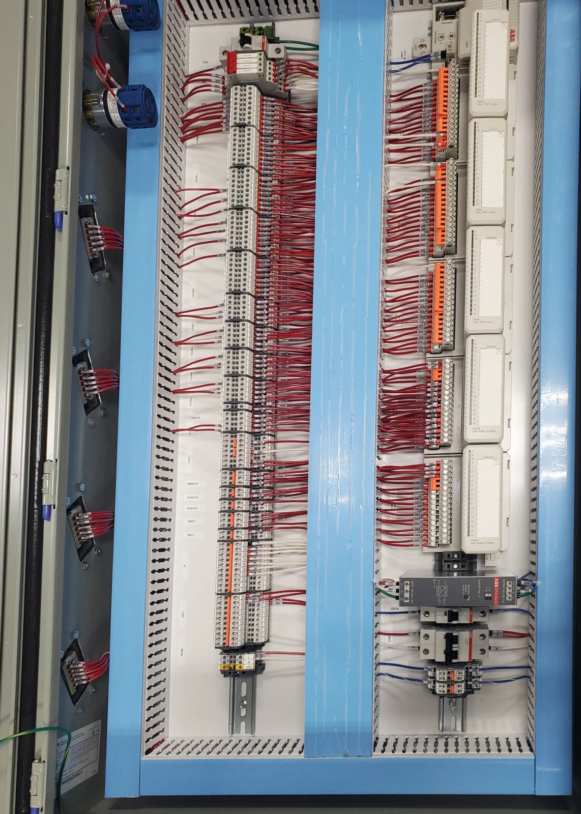 DCS I/O panel: dense terminal-block wiring with power distribution below